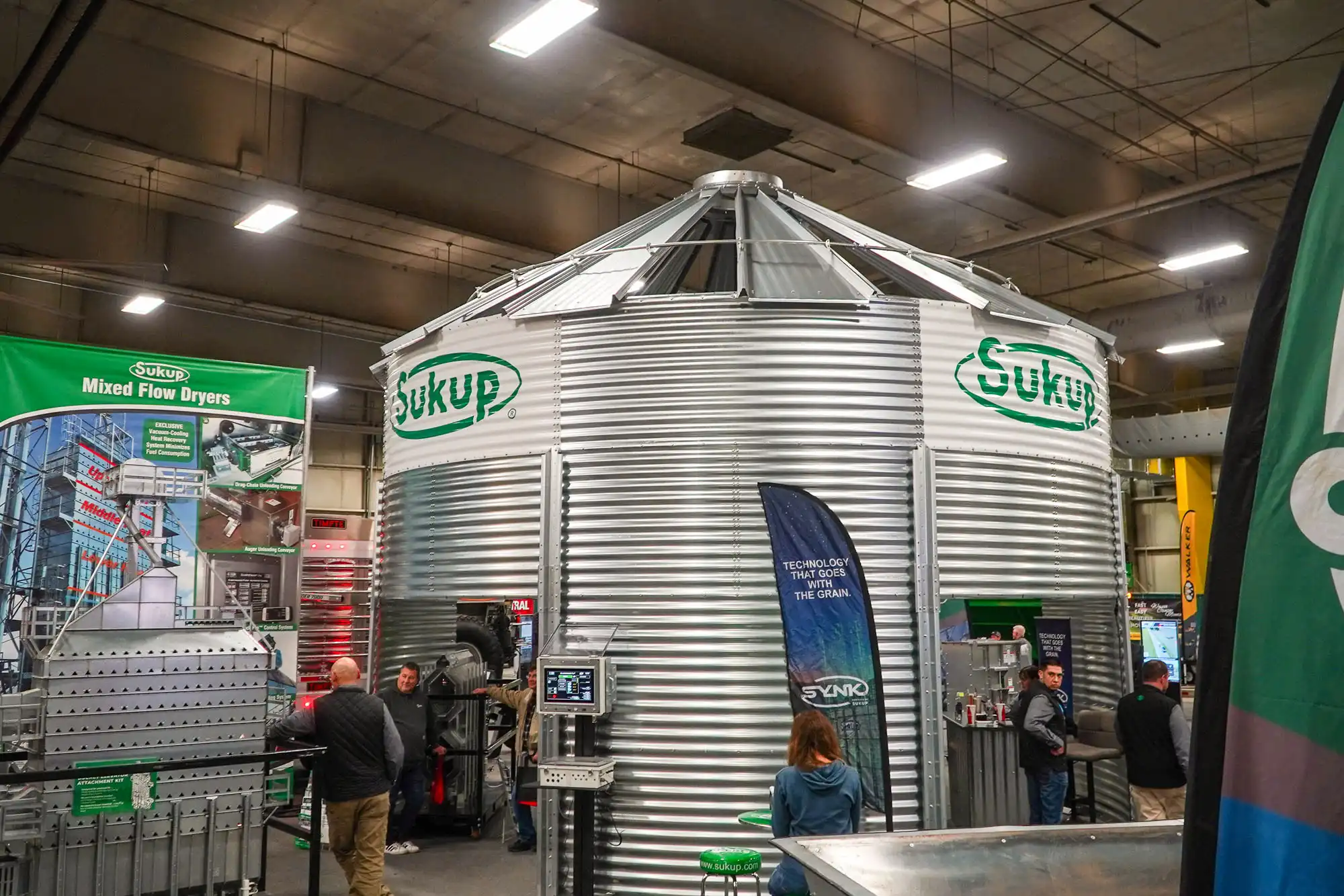 Attendees of the Nebraska Ag Expo inspect a grain bin built and designed by Sukup.